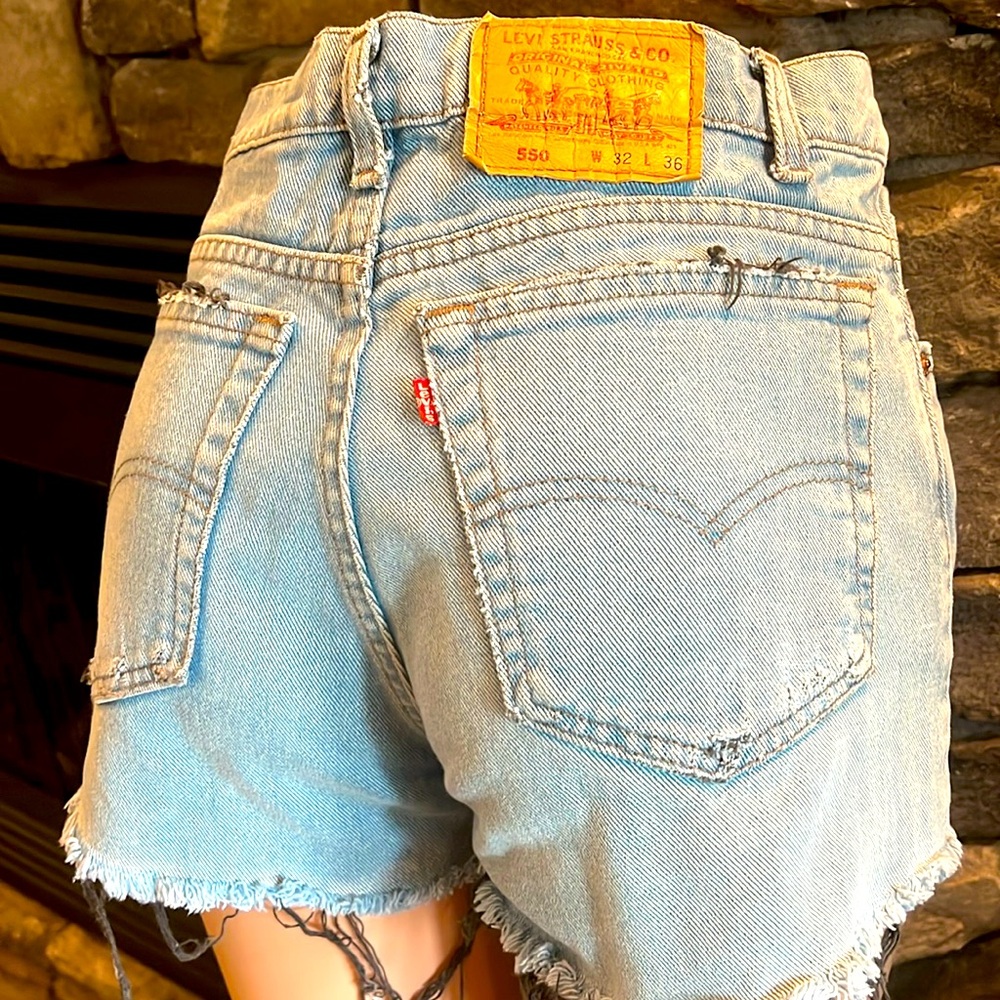 Levi’s vintage jean shorts is a unique blue colour with black fringe
